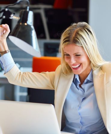 Successful business woman and man working at the office